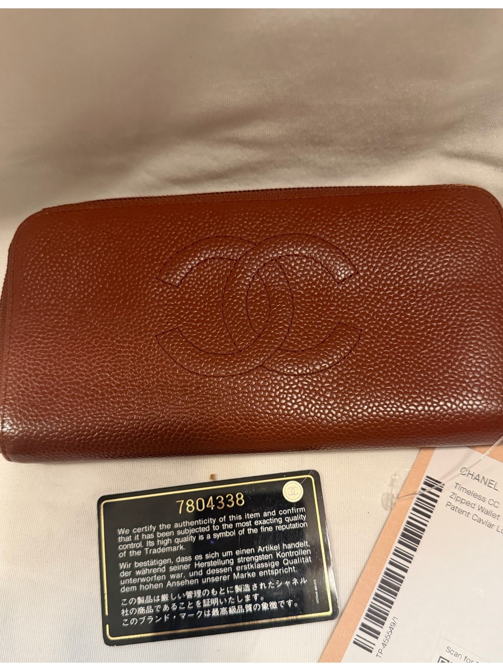 CHANEL Brown Pebbled Caviar Leather Zip-Around Wallet with Embossed CC